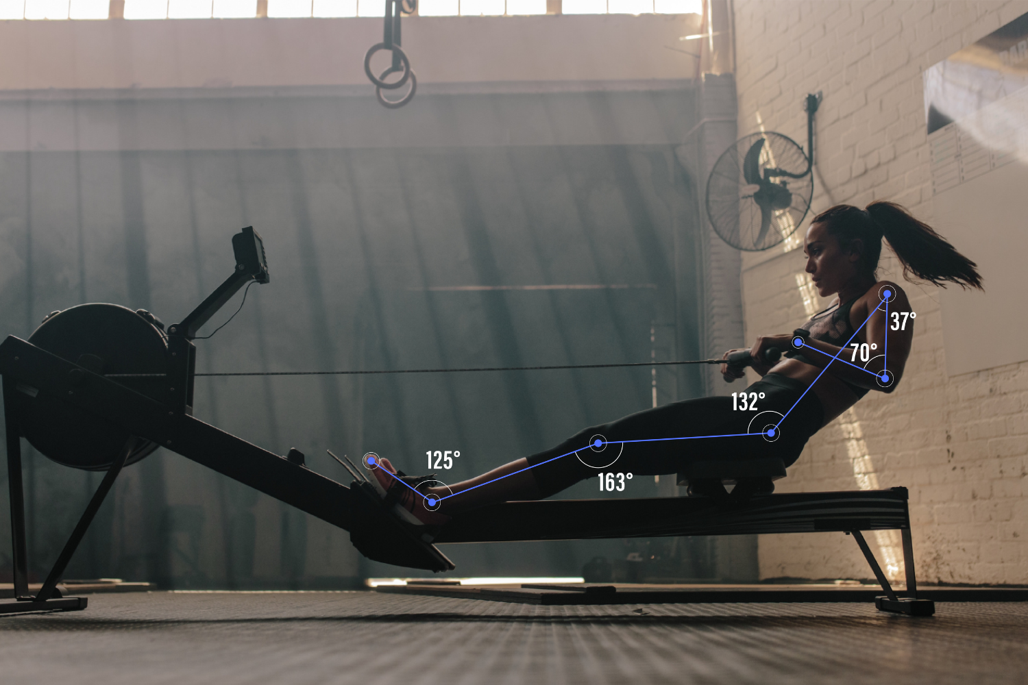 Computer vision pose estimation analyzing rowing posture with live joint angle tracking during exercise.